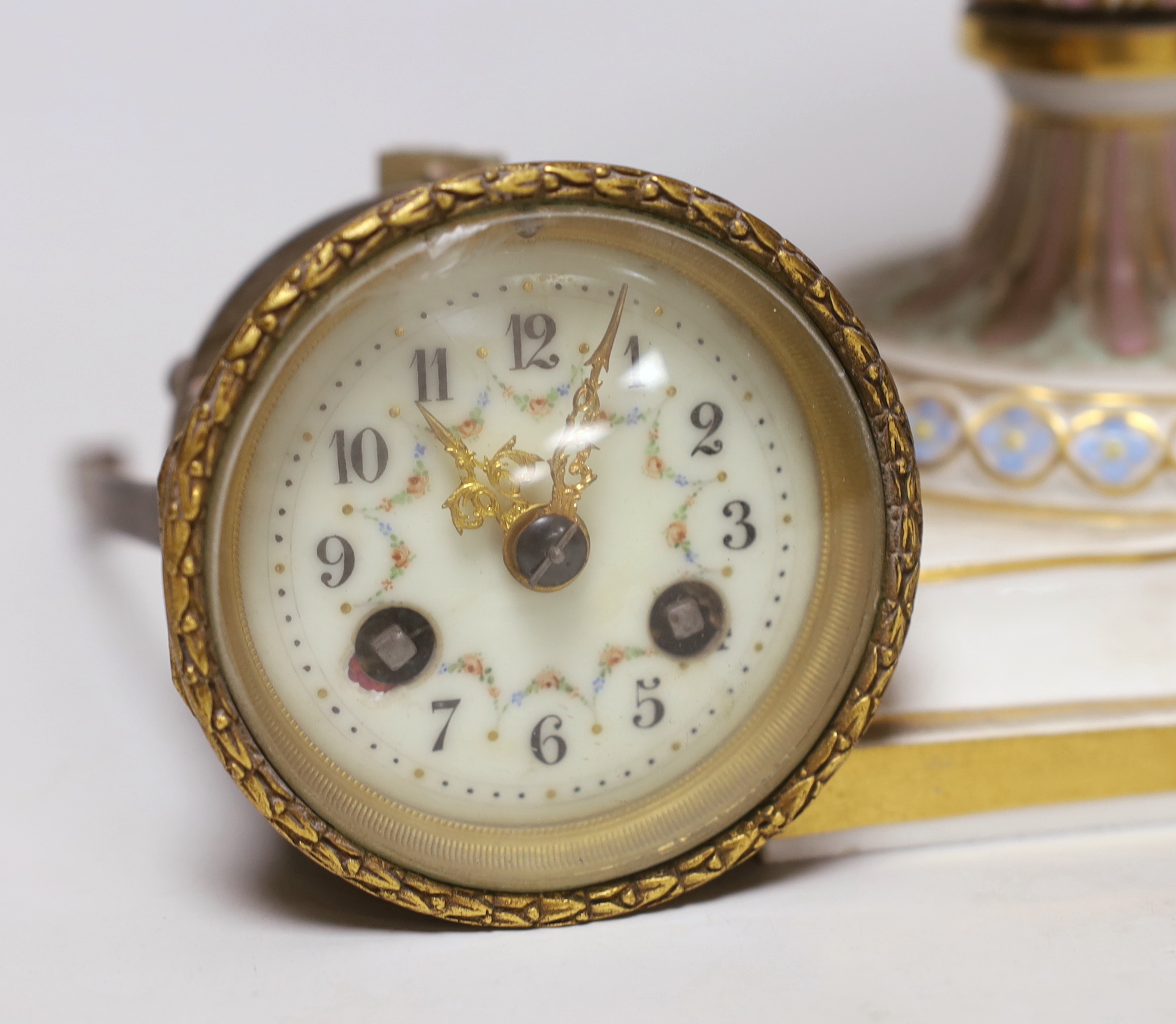 A late 19th century Meissen clock of square form with Watteau scenes and lion mask handles, top missing, 26cm